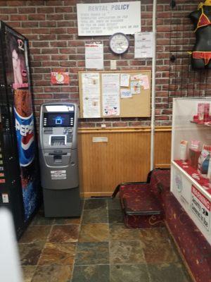 Front counter, side with ATM, soda machine, first glance