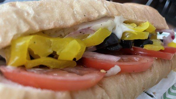 Grilled Chicken Sub with banana peppers and black olives.