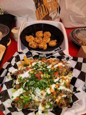 The best fries (middle eastern fries) ever! Way better than carne asada fries! The shrimp is from another place (the bag behind the shrimp).