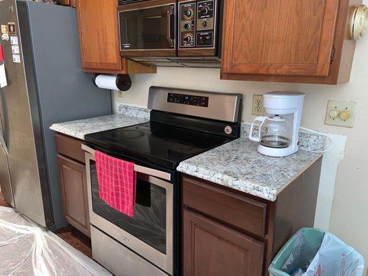 Matching counter top stove area on Brian T. home.  We make sure we work with your insurance company so that everything matches.