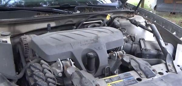 Photo of my engine shield in fact being on my car the day before I took it in to them for the oil change