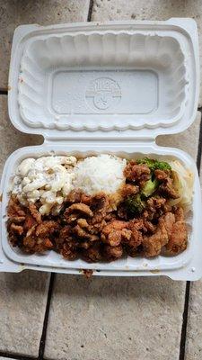 Garlic chicken with rice, veggies and Mac salad.