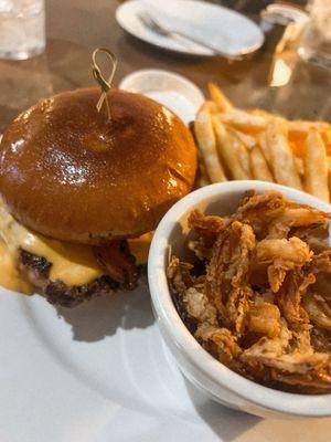 Bison burger with crispy onions on the side