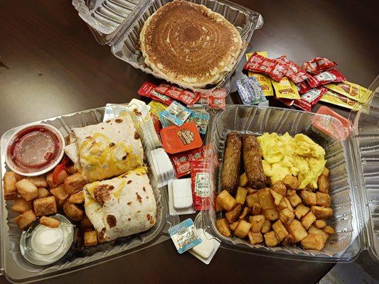 Carryoutr breakfast to our room. Breakfast Platter with eggs, sausage, fried potatoes and pancakes.  Whew! Also shown, breakfast burrito.