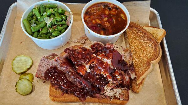 Two meat meal with green beans and baked beans