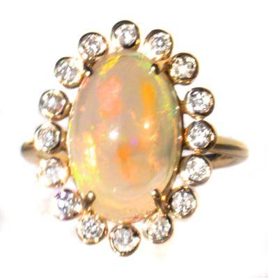 Materials
 Gold
 Gemstone: Opal
 Size
 5 US
 This is the perfect size, shape and color opal for a beautiful ring.