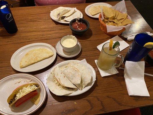 Soft tacos, a hard shell taco, 2 cheese quesadillas, cheese and a margarita.