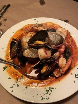 Cioppino served with crusty hot bread and a beautiful side salad with house made dressing.