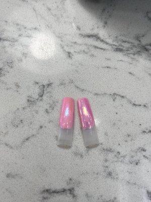 the two nail tips both with the same bright pink nail polish but with TWO DIFFERENT CHROME FINISHES