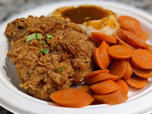 Fried pork chop with carrots and mashed potatoes and gravy. Really good. I demolished this.