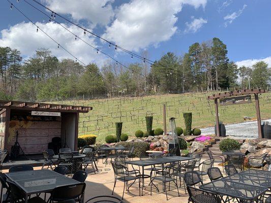 View of patio with stage and vineyard