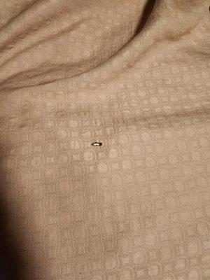 The Bed cover with a burnt.