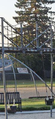 Rusty aging swing set.