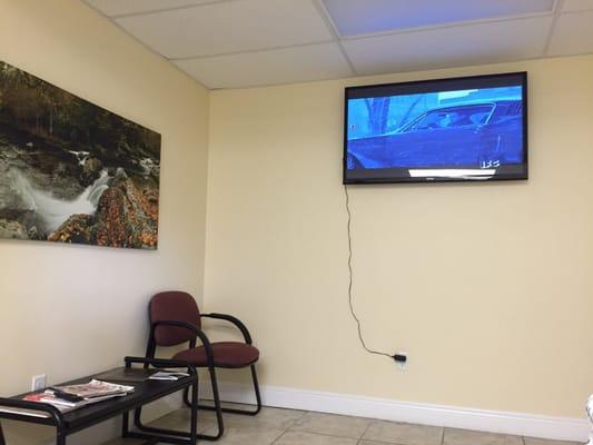 Tv in service customer waiting room that won't change channels.  Had to mute it due to the channel it was on- vulgar language