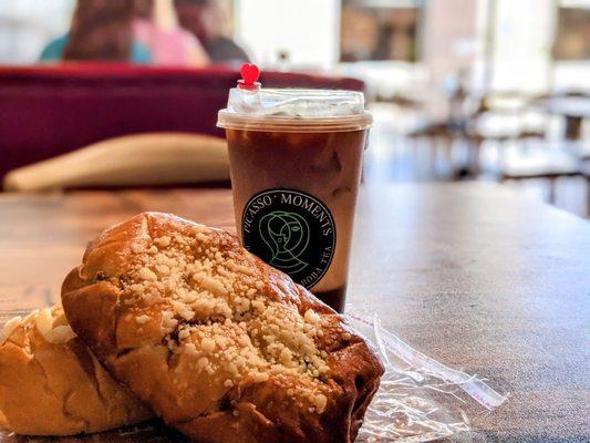 Cold Brew Mocha Coffee, double cheese and beef bread resting on a custard cake bread