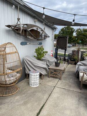 Outside area. The chairs were still covered maybe bc of rain? But I'm sure an awesome place to relax.