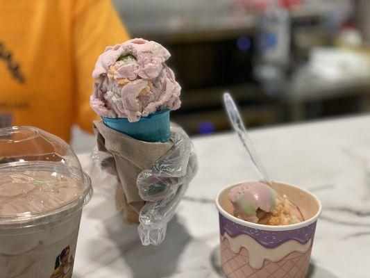 Rainbow sherbet in a blue cake cone.  Chocolate shaker.  Rainbow sherbet in a cup.