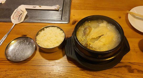 Samgyetang with a side of rice.