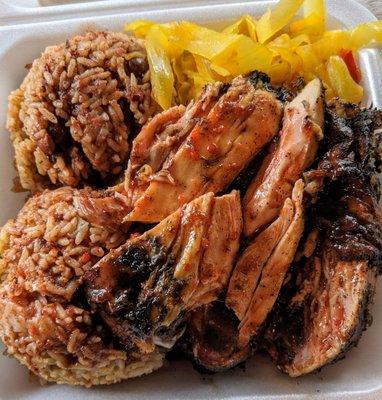 Jerk chicken, spicy rice and beans, and steamed cabbage.