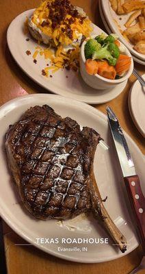 Bone in rib-eye, loaded potato and steam veggies