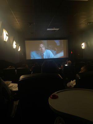 Inside the theatre-- Small. Seats don't recline. Dine in movie theatre.