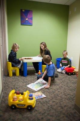 Kids room with games, toys, books and flat screen TV to keep little ones entertained.