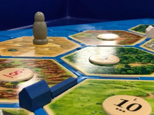 Play classic games like Settlers of Catan. . .