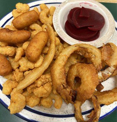 Popcorn shrimp with onion rings, beets, and hush puppies