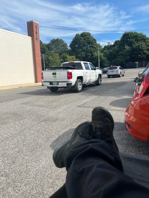 Sitting in the parking lot...waiting to be seen.  Not allowed to be inside