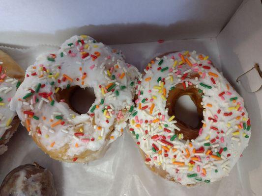 Glazed doughnuts with sprinkles.