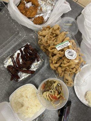 Lao Style Fried Chicken, Beef Jerky, Lao Style Papaya Salad & Sticky Rice.