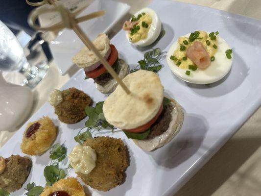 Mediterranean lamb burger sliders . Smoked salmon, deviled eggs, lobster mac & cheese bites, southwest crabcake bites