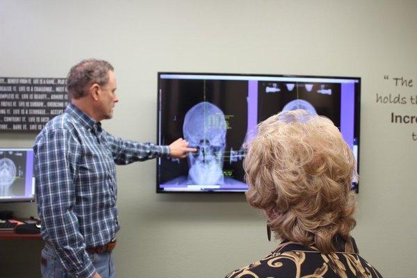 Dr. Greg Dutson explaining a patient's x-rays