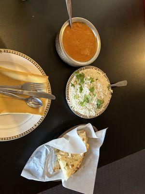 The lamb korma (lamb cooked in coconut in a creamy sauce).   Basmati rice with cumin.   Garlic Naan. I have to say, mouth melting flavors.