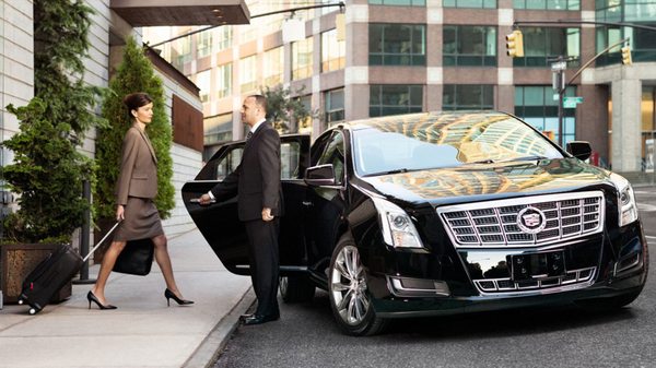 Our corporate luxury sedans are black on black with tinted back windows for extra privacy. It has plenty of leg room.