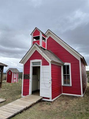 Single room school house (with matching outhouse?).  (You can ring the bell! )