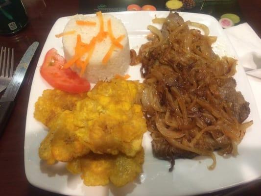 Grilled steak with onions, tostones and white rice