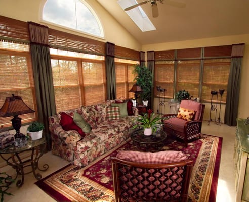 Cozy and comfortable sun room with a warm color palette and texture.