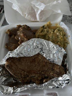 Fried pork chops, broccoli casserole, and cornbread Dressing with Gravy