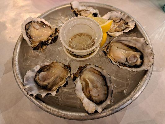 Happy Hour Oysters $2 each with 6 oyster minimum. Server said these are Steamboat Oysters from Washington. Receipt said Blue Point Oysters.