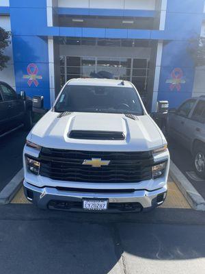 View of truck with Harley in bed