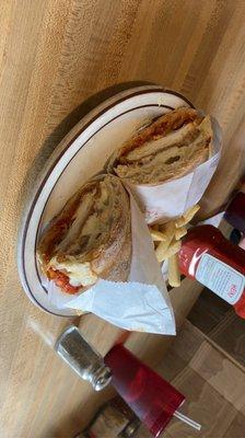 Chicken Parmesan panini with fries