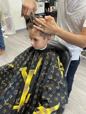 My son getting his hair cut.