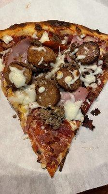 Meat lovers slice of pizza !