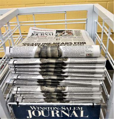 Stack of Winston-Salem Journal papers.