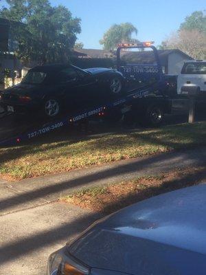 Car gently pulled and secured in place for ride to Reeves BMW