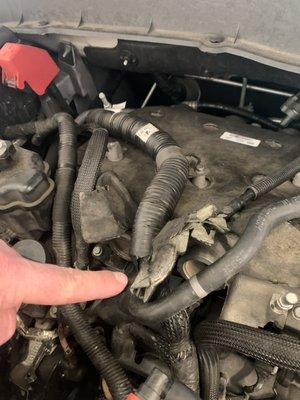 Improper placement of heat cover for the exhaust manifold causing it to bend and flare out.