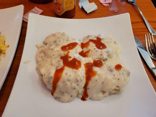 Sausage gravy and biscuit (full order). Hot sauce not included. Lol. Put hot sauce on before I remembered to take picture.