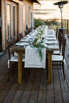 Rented table, plates, glasses, silverware, chairs and cushions