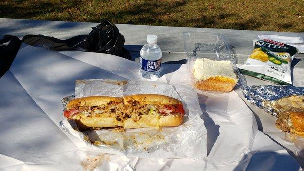 Small chicken cheese steak sub $7.75 with orange cake,  jalapeno chips and a small water